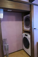 長期滞在向けに洗濯機・ガス乾燥機も完備